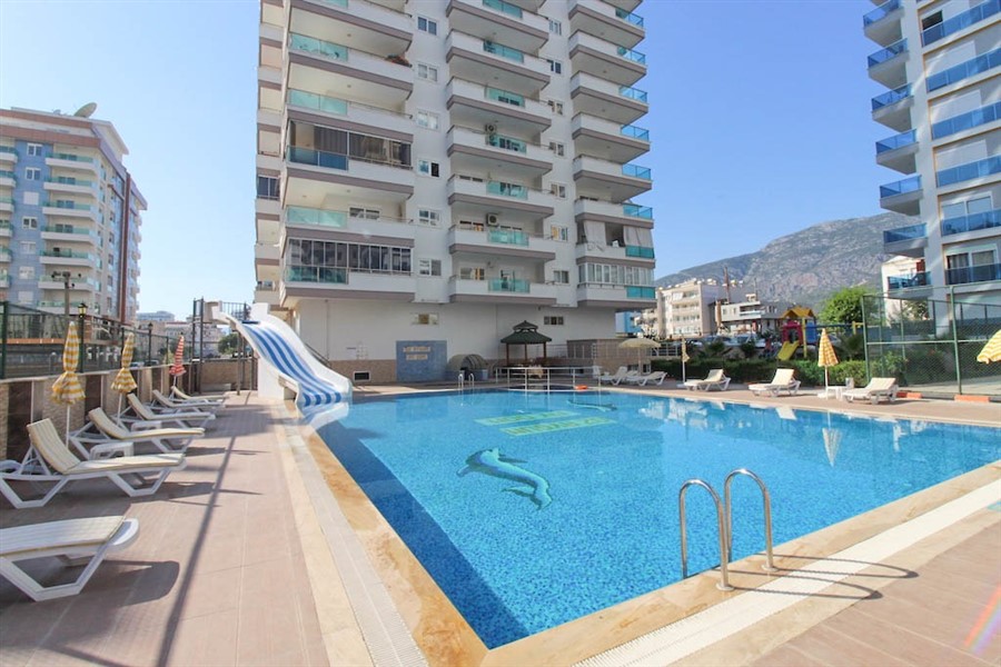 A cozy furnished 1+1 apartment of 60 m² in a residential complex with a swimming pool in the center of Mahmutlar-id-10236-photo-1