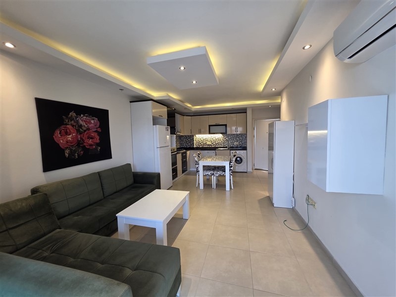 A cozy furnished 1+1 apartment of 60 m² in a residential complex with a swimming pool in the center of Mahmutlar-id-10236-photo-2