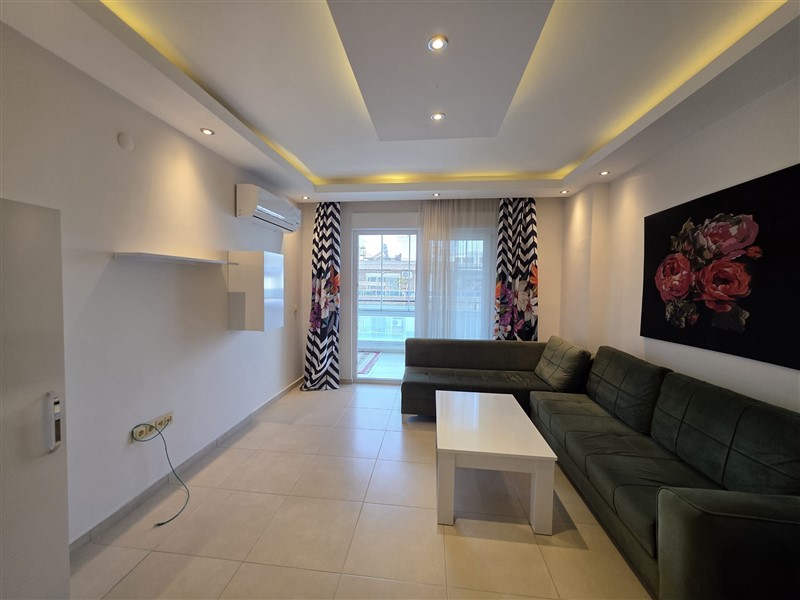 A cozy furnished 1+1 apartment of 60 m² in a residential complex with a swimming pool in the center of Mahmutlar-id-10236-photo-3