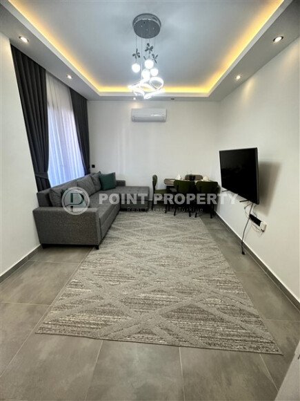Furnished 1+1 apartment with partial sea view in a complex with infrastructure in Mahmutlar-id-10243-photo-2