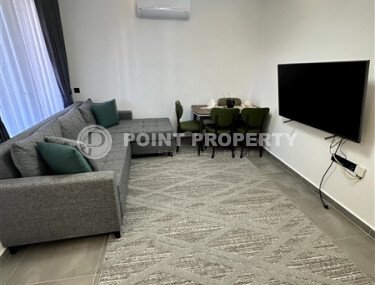 Furnished 1+1 apartment with partial sea view in a complex with infrastructure in Mahmutlar-id-10243-photo-3