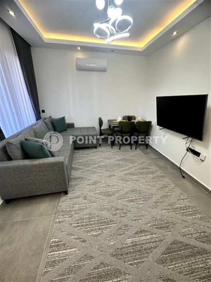 Furnished 1+1 apartment with partial sea view in a complex with infrastructure in Mahmutlar-id-10243-photo-3