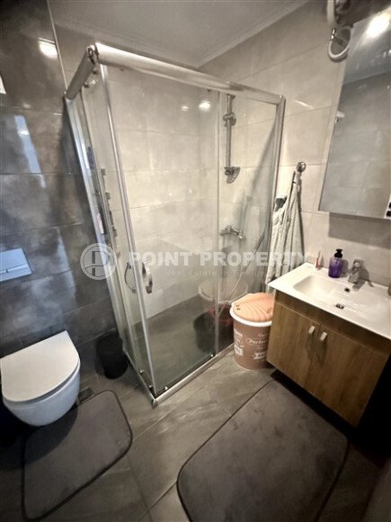 Furnished 1+1 apartment with partial sea view in a complex with infrastructure in Mahmutlar-id-10243-photo-6