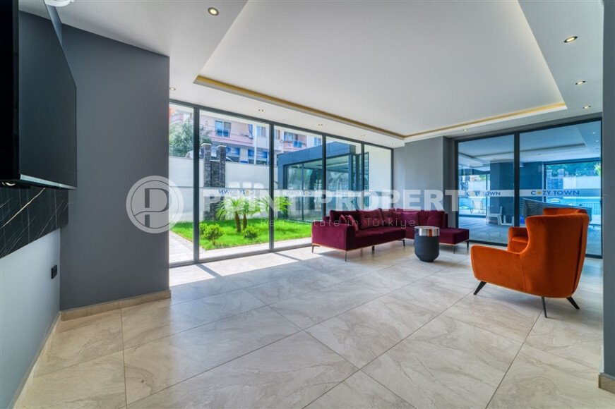 Furnished 1+1 apartment with partial sea view in a complex with infrastructure in Mahmutlar-id-10243-photo-7