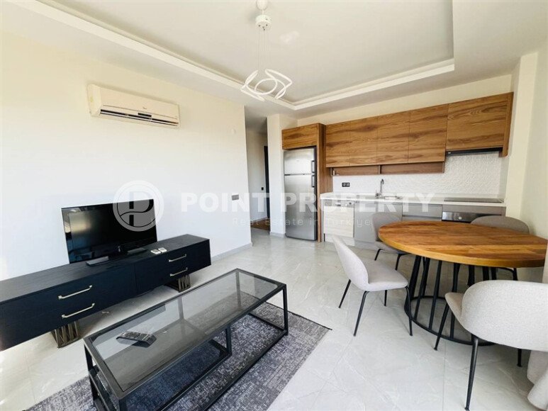 Furnished 2+1 apartment with sea views in a complex with infrastructure in Mahmutlar-id-10244-photo-1