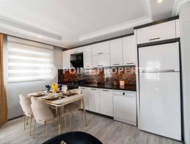 Современная и светлая квартира 110 м² с двумя балконами в комплексе с бассейном в Махмутларе-id-10259-фото-2