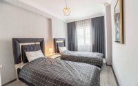Современная и светлая квартира 110 м² с двумя балконами в комплексе с бассейном в Махмутларе-id-10259-фото-5