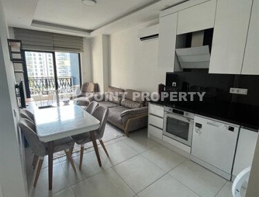 A bright, furnished 56 m² apartment with views of the infrastructure in a modern complex in Mahmutlar-id-10261-photo-2