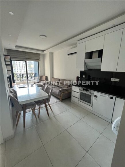 Светлая меблированная квартира 56 м² с видом на инфраструктуру в современном комплексе в Махмутларе-id-10261-фото-2