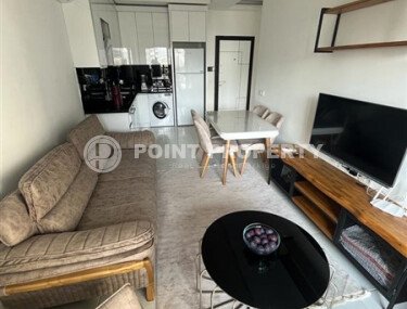 A bright, furnished 56 m² apartment with views of the infrastructure in a modern complex in Mahmutlar-id-10261-photo-4