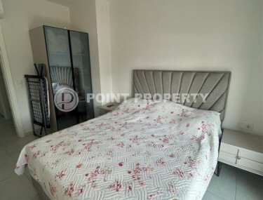 A bright, furnished 56 m² apartment with views of the infrastructure in a modern complex in Mahmutlar-id-10261-photo-5