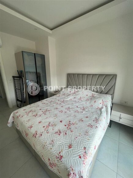 Светлая меблированная квартира 56 м² с видом на инфраструктуру в современном комплексе в Махмутларе-id-10261-фото-5