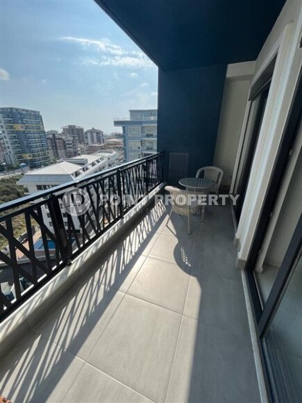 Светлая меблированная квартира 56 м² с видом на инфраструктуру в современном комплексе в Махмутларе-id-10261-фото-7