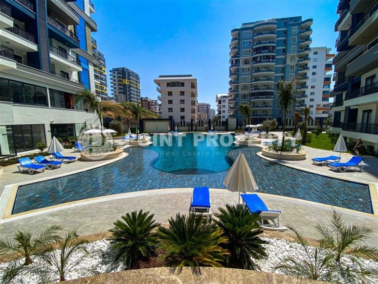 Светлая меблированная квартира 56 м² с видом на инфраструктуру в современном комплексе в Махмутларе-id-10261-фото-8