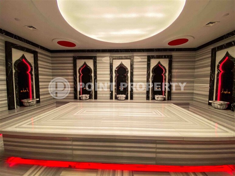 Светлая меблированная квартира 56 м² с видом на инфраструктуру в современном комплексе в Махмутларе-id-10261-фото-12