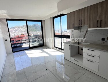 Компактные апартаменты 57 м2 с отличной локацией в самом центре Аланьи. 450 метров до пляжа Клеопатры.-id-3923-фото-2