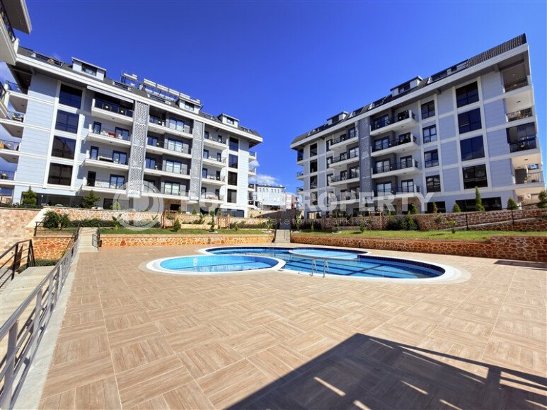 Современная просторная квартира 70 м² в новом комплексе с богатой инфраструктурой в районе Оба, Аланья-id-10299-фото-12