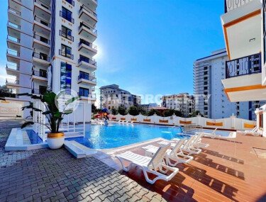 Стильная современная квартира 55 м² в новом жилом комплексе класса люкс в Махмутларе, Аланья-id-10304-фото-1
