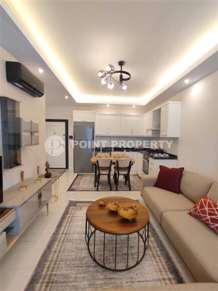 Стильная современная квартира 55 м² в новом жилом комплексе класса люкс в Махмутларе, Аланья-id-10304-фото-2