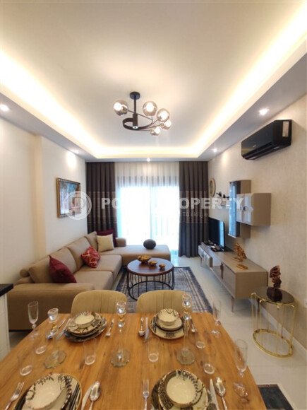 Стильная современная квартира 55 м² в новом жилом комплексе класса люкс в Махмутларе, Аланья-id-10304-фото-3