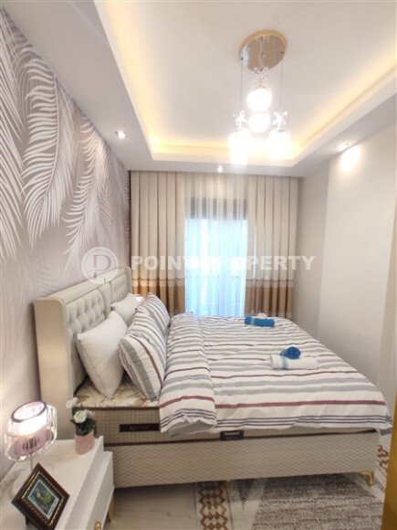 Стильная современная квартира 55 м² в новом жилом комплексе класса люкс в Махмутларе, Аланья-id-10304-фото-5