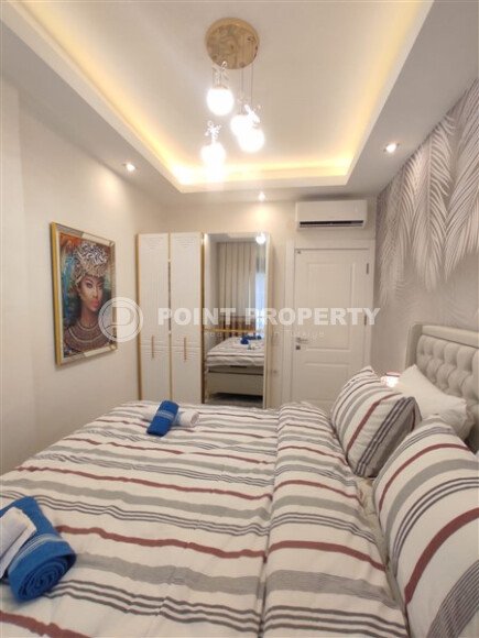 Стильная современная квартира 55 м² в новом жилом комплексе класса люкс в Махмутларе, Аланья-id-10304-фото-6