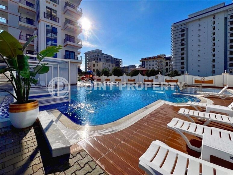 Стильная современная квартира 55 м² в новом жилом комплексе класса люкс в Махмутларе, Аланья-id-10304-фото-7