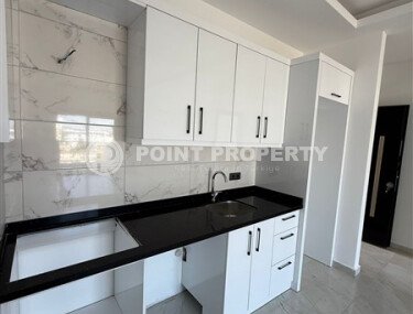 1+1 apartment in a new residential complex in Mahmutlar-id-10311-photo-4