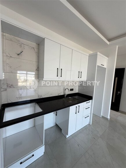 1+1 apartment in a new residential complex in Mahmutlar-id-10311-photo-4