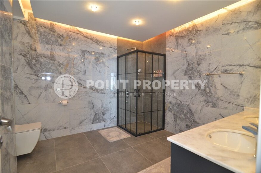 An elegant 351 m² villa with a panoramic terrace and sea views in a prestigious area of Alanya-id-10313-photo-14