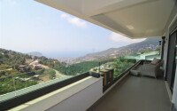 An elegant 351 m² villa with a panoramic terrace and sea views in a prestigious area of Alanya-id-10313-photo-17