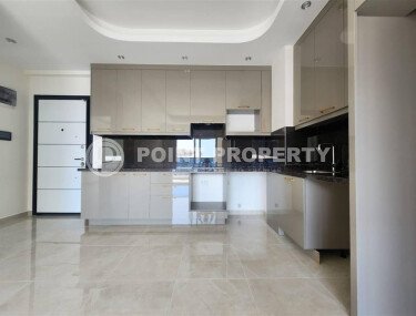 Современная светлая квартира 1+1 площадью 58 м² в жилом комплексе с развитой инфраструктурой в районе Махмутлар-id-10319-фото-3