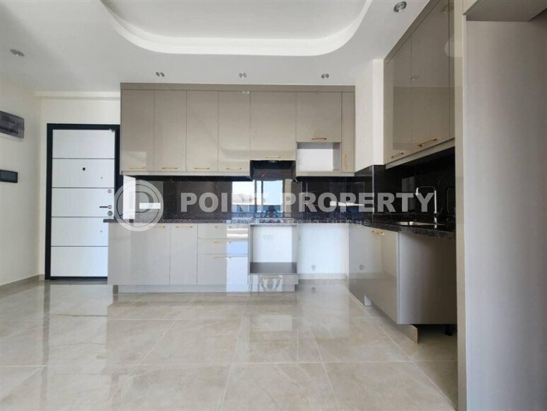A modern, bright 1+1 apartment of 58 m² in a residential complex with developed infrastructure in the Mahmutlar area-id-10319-photo-3