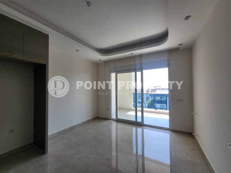 A modern, bright 1+1 apartment of 58 m² in a residential complex with developed infrastructure in the Mahmutlar area-id-10319-photo-4