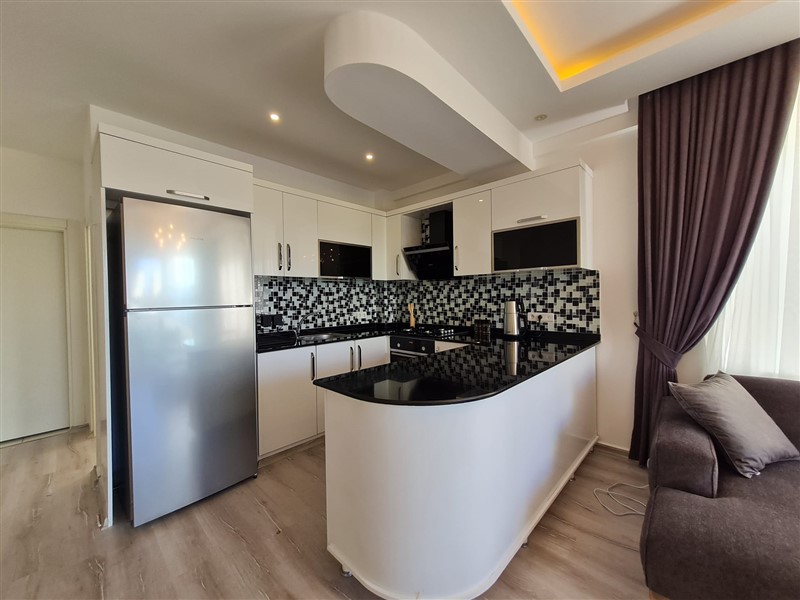 A cozy 1+1 apartment of 60 m² in a residential complex with full infrastructure in the Mahmutlar area-id-10321-photo-2