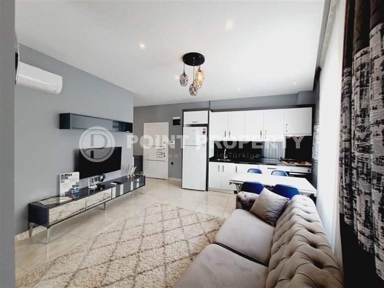 A modern, bright 2+1 apartment of 70 m² in the center of Alanya with luxurious infrastructure-id-10346-photo-1