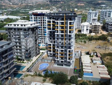 Квартиры 1+1 и 2+1, 42-78м², в комплексе на этапе строительства в Махмутларе, Алания, в 400м от моря-id-2447-фото-1