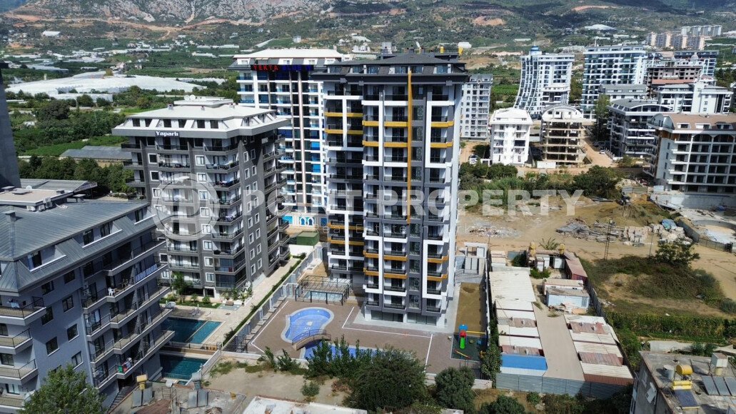 Квартиры 1+1 и 2+1, 42-78м², в комплексе на этапе строительства в Махмутларе, Алания, в 400м от моря-id-2447-фото-1