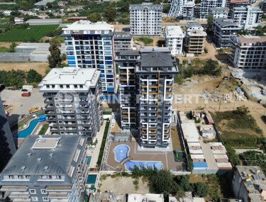 Квартиры 1+1 и 2+1, 42-78м², в комплексе на этапе строительства в Махмутларе, Алания, в 400м от моря-id-2447-фото-1