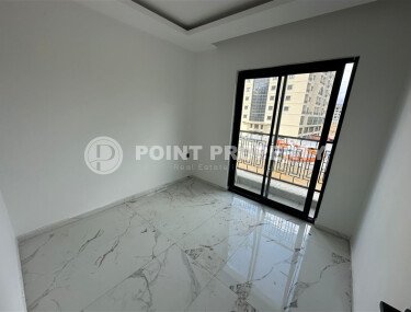 Элегантная современная квартира 47 м² в уютном жилом комплексе с развитой инфраструктурой в Махмутларе-id-10359-фото-2