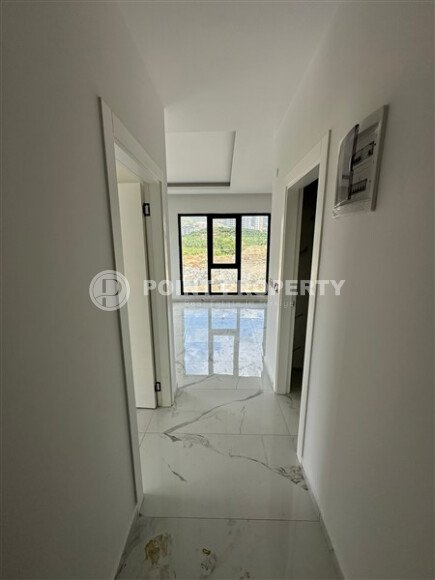 Элегантная современная квартира 47 м² в уютном жилом комплексе с развитой инфраструктурой в Махмутларе-id-10359-фото-3