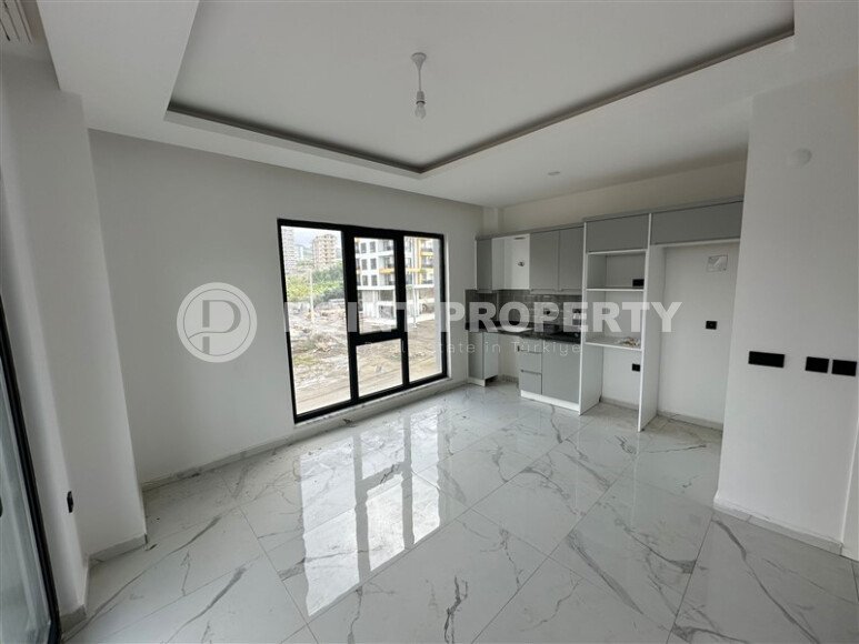 Элегантная современная квартира 47 м² в уютном жилом комплексе с развитой инфраструктурой в Махмутларе-id-10359-фото-4