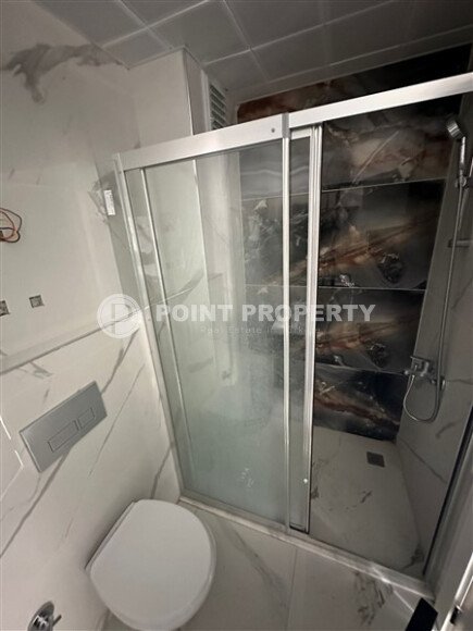 Элегантная современная квартира 47 м² в уютном жилом комплексе с развитой инфраструктурой в Махмутларе-id-10359-фото-6