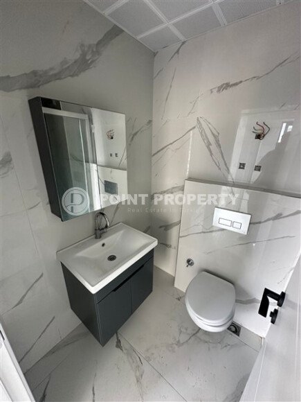 Элегантная современная квартира 47 м² в уютном жилом комплексе с развитой инфраструктурой в Махмутларе-id-10359-фото-7