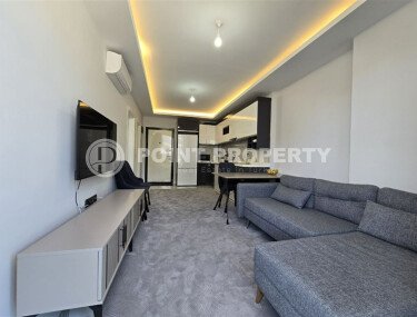 Современная квартира 1+1, 50 м², район Махмутлар, с крытой парковкой-id-10374-фото-2