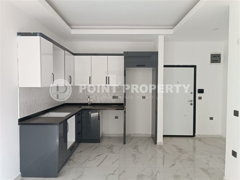 1+1 квартира 50 м² в новом комплексе Махмутлара с богатой инфраструктурой-id-10425-фото-5