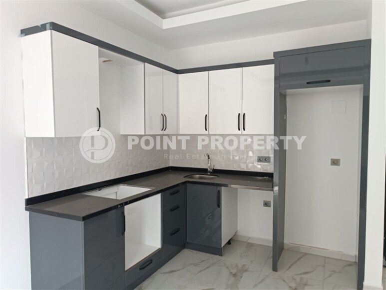 1+1 квартира 50 м² в новом комплексе Махмутлара с богатой инфраструктурой-id-10425-фото-7