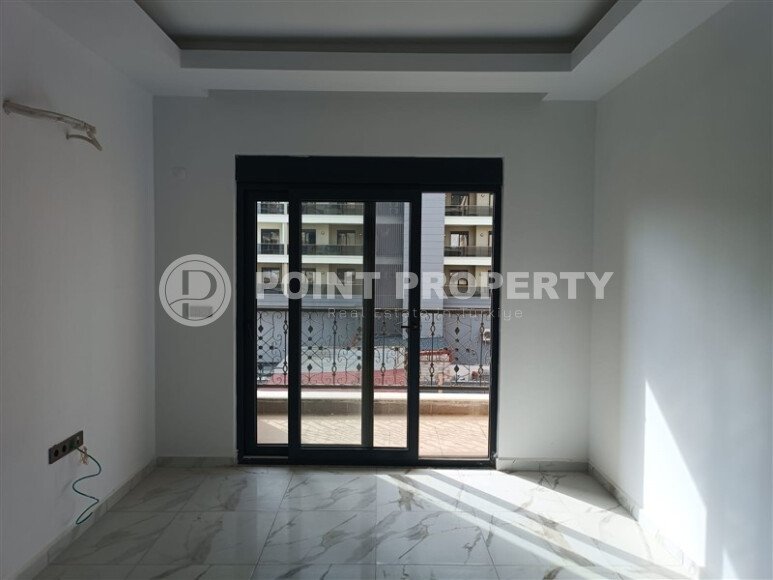 1+1 квартира 50 м² в новом комплексе Махмутлара с богатой инфраструктурой-id-10425-фото-11