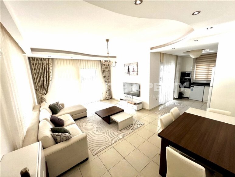 Spacious 2+1 apartment – 100 m2 with a beautiful view of the pool and surrounding area in Mahmutlar-id-10450-photo-1