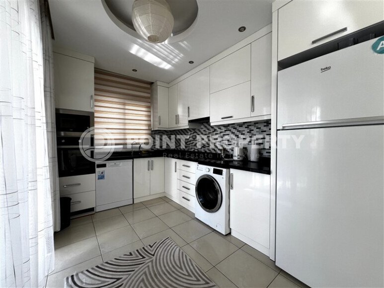 Spacious 2+1 apartment – 100 m2 with a beautiful view of the pool and surrounding area in Mahmutlar-id-10450-photo-3